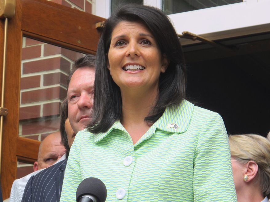 South Carolina Gov. Nikki Haley speaks with reporters outside the Jasper County office building in Ridgeland, S.C., on Monday, May 2, 2016, after a briefing on a $4.5 billion container terminal South Carolina and Georgia are jointly building on the Savannah River. Haley said lawmakers in both states will soon need to begin banking money to help pay for the 1,500-acre project. Planners say the first phase needs to open by 2025. (AP Photo/Bruce Smith)