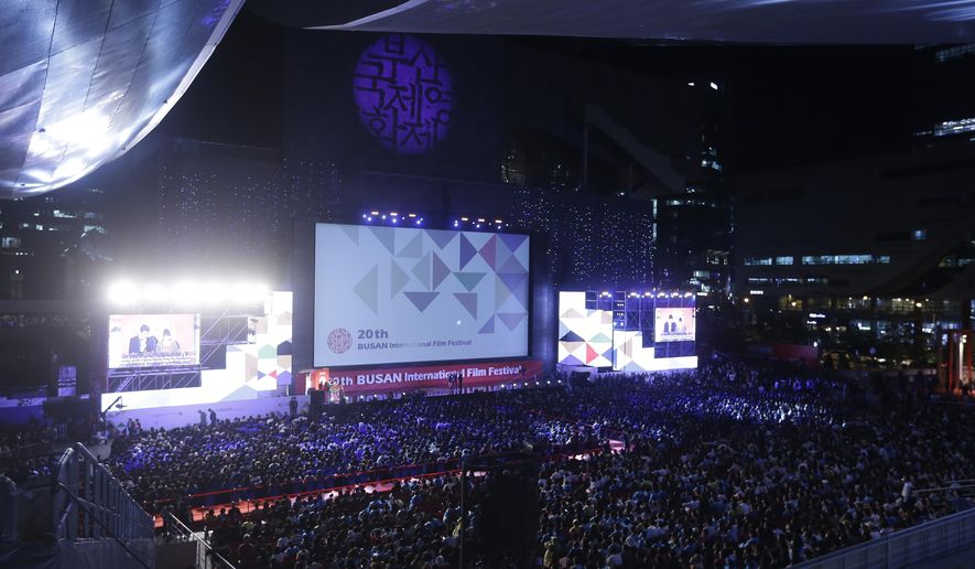FILE - In this Oct. 1, 2015, file photo, people attend the opening ceremony of the Busan International Film Festival at Busan Cinema Center in Busan, South Korea. The future of Asia’s largest, most-awaited film festival is in question as local filmmakers threaten to boycott the red carpet over what they view as government interference. (AP Photo/Ahn Young-joon, File)