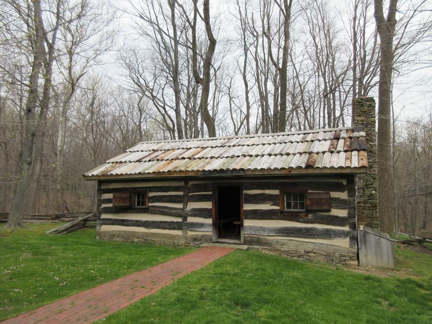 This April 22, 2016 photo shows a replica of a log cabin where President James Garfield was born in Moreland Hills, Ohio. He was the last president born in a log cabin. (AP Photo/Beth J. Harpaz)
