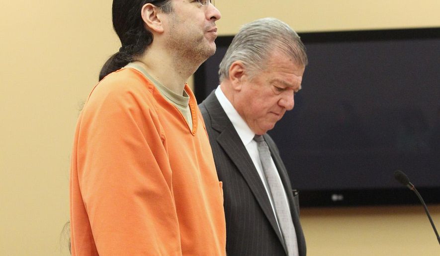 Derek Bailey stands with attorney Craig Elhart on Monday, May 2, 2016 in Suttons Bay, Mich. Bailey, a former chairman of a northern Michigan Indian tribe, has been sentenced to at least 25 years in prison for first-degree criminal sexual conduct against a girl in the Traverse City area. (Jan-Michael Stump/Traverse City Record-Eagle via AP)
