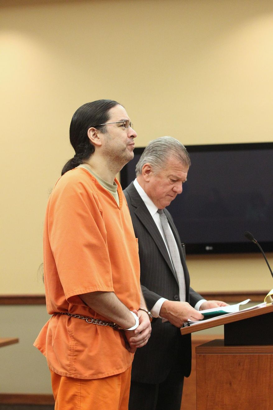 Derek Bailey stands with attorney Craig Elhart on Monday, May 2, 2016 in Suttons Bay, Mich. Bailey, a former chairman of a northern Michigan Indian tribe, has been sentenced to at least 25 years in prison for first-degree criminal sexual conduct against a girl in the Traverse City area. (Jan-Michael Stump/Traverse City Record-Eagle via AP)