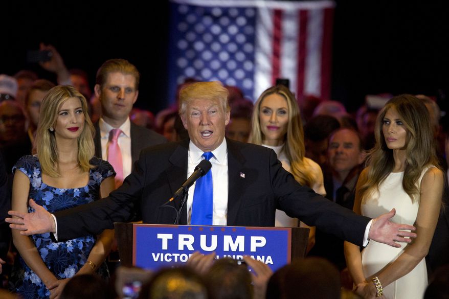 Republican presidential candidate Donald Trump is joined by his wife Melania, right, daughter Ivanka, left, and son Eric, background left, as he speaks during a primary night news conference, Tuesday, May 3, 2016, in New York. (AP Photo/Mary Altaffer)