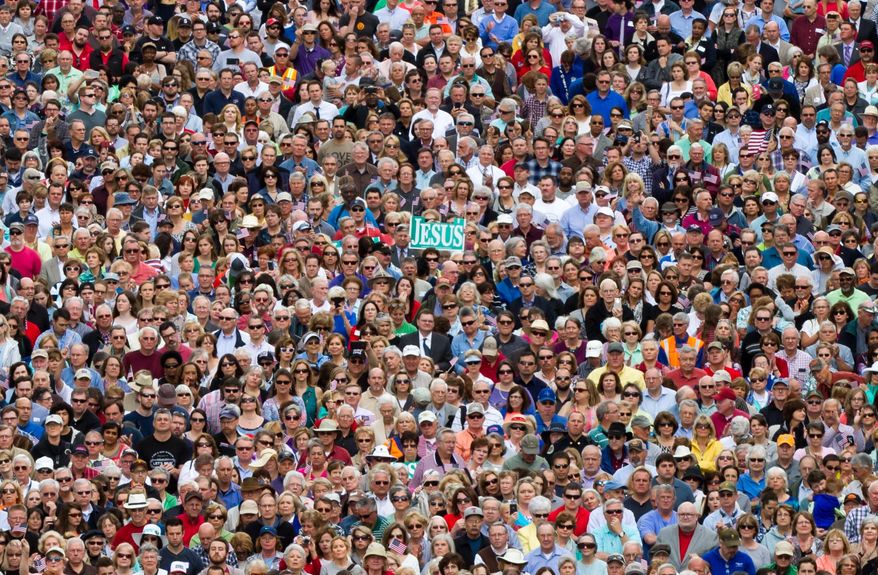Thousands gather for a prayer rally with evangelist Franklin Graham on the plaza across the street from the state Capitol in Nashville, Tenn., on Tuesday, May 3, 2016. (AP Photo/Erik Schelzig)