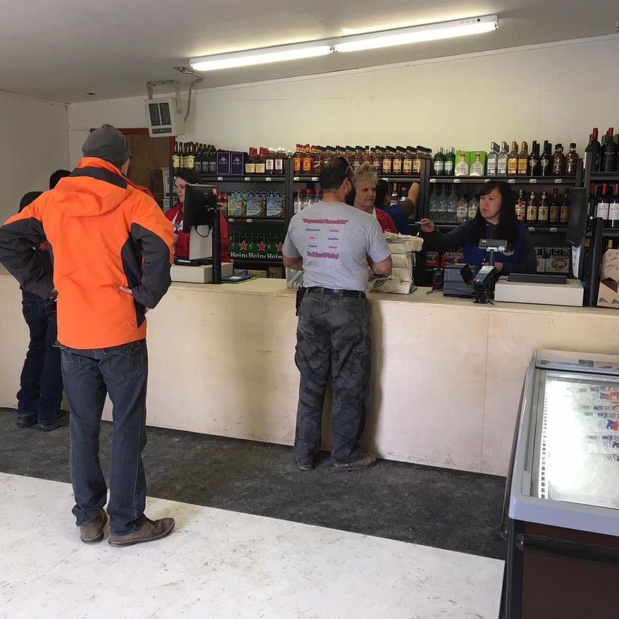 This photo provided by Walter Pickett shows the interior of the new AC Quickstop liquor store on Tuesday, May 3, 2016, in Bethel, Alaska. The liquor store is the first in 40 years to open in this southwestern community, where residents had to get liquor sent through the mail after residents voted to no longer be a dry community. The new business is owned by Alaska Commercial Company. (Walter Pickett via AP)