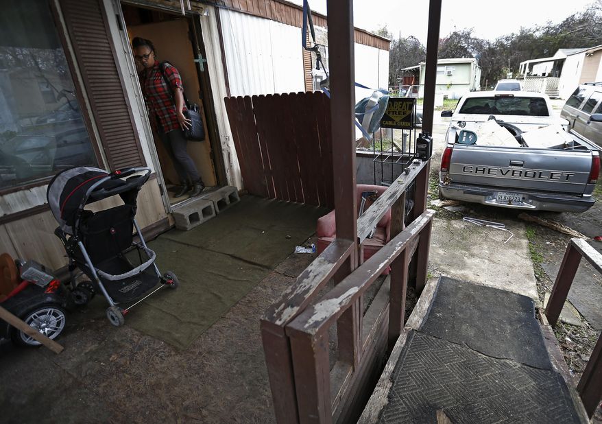 In this c, Child Protective Services specialist Nakiba Pruitt leaves a home after visiting a family for an investigation in Dallas. Over the last two months, on any given day, more than 3,400 children who were on the radar of Child Protective Services hadn't been seen once by a caseworker, according to state data of face-to-face interactions analyzed by The Dallas Morning News. (Jae S. Lee/The Dallas Morning News via AP)