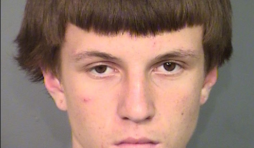 This undated photo provided by Las Vegas Metropolitan Police Department shows Jason Lloyd Carlton II, who pleaded not guilty Tuesday, May 3, 2016, as an adult to murder, robbery and conspiracy charges in the stabbing death of a man at a fast-food restaurant. (Clark County Detention Center/Las Vegas Metropolitan Police Department via AP)