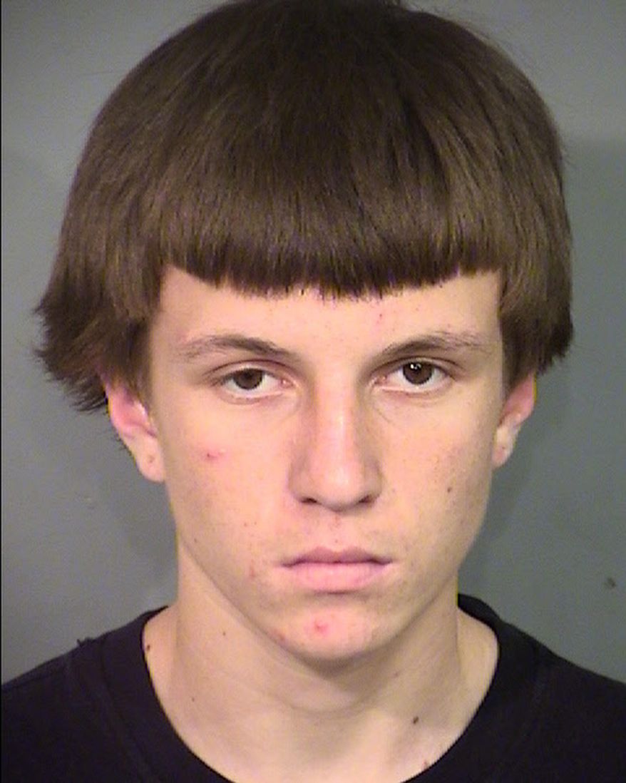 This undated photo provided by Las Vegas Metropolitan Police Department shows Jason Lloyd Carlton II, who pleaded not guilty Tuesday, May 3, 2016, as an adult to murder, robbery and conspiracy charges in the stabbing death of a man at a fast-food restaurant. (Clark County Detention Center/Las Vegas Metropolitan Police Department via AP)