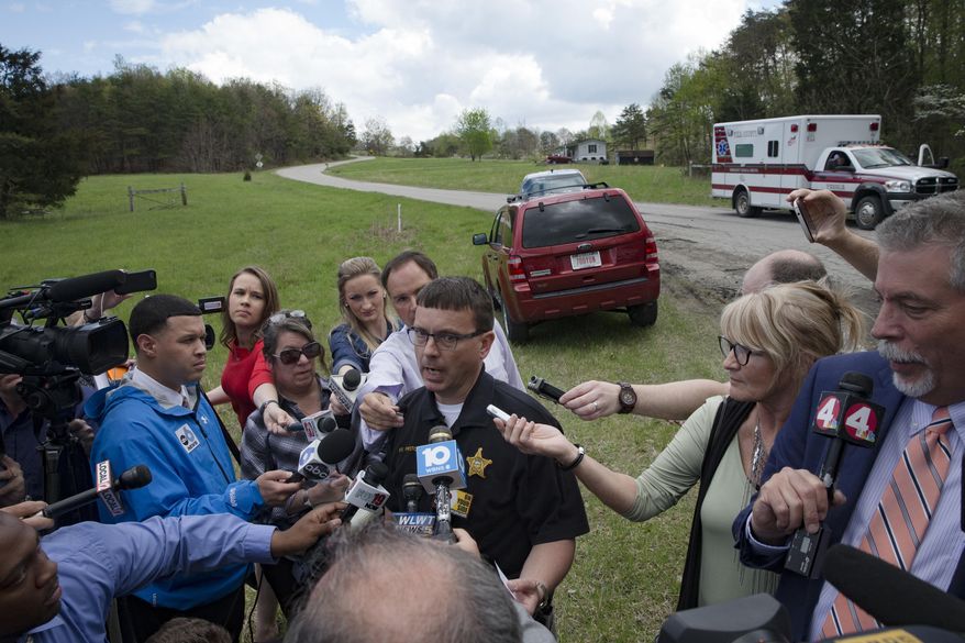 In this Friday, April 22, 2016, file photo, Lt. Michael Preston, of the Ross County Sheriff's Department speaks to the media on Union Hill Road that approaches a crime scene in Pike County, Ohio, after shootings with multiple fatalities were reported along the road in rural Ohio on Friday morning. (AP Photo/John Minchillo, File)
