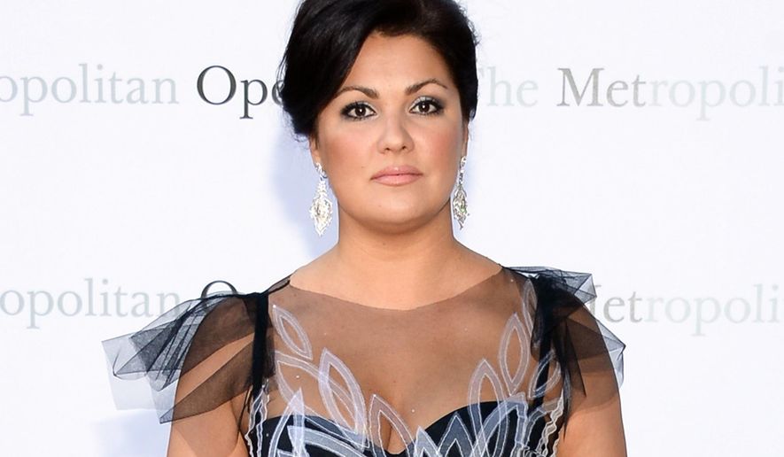 FILE - In this Sept. 22, 2014 file photo, soprano Anna Netrebko attends the Metropolitan Opera 2014-15 season opening production of Mozart's "Marriage of Figaro" at Lincoln Center in New York. New York's Metropolitan Opera said Tuesday, May 3, 2016, it will replace Netrebko with Sonya Yoncheva in Bellini's "Norma" opening Sept. 12. (Photo by Evan Agostini/Invision/AP, File)