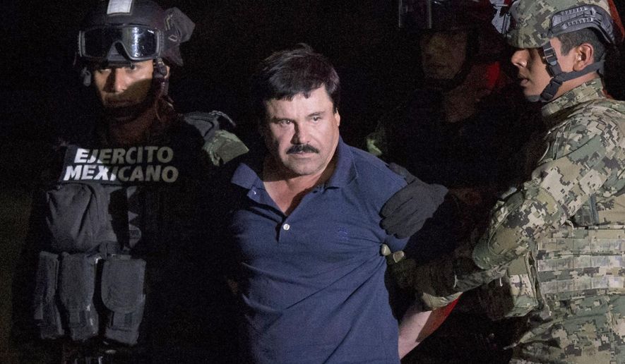 FILE - In this Jan. 8, 2016 file photo, Mexican drug lord Joaquin "El Chapo" Guzman is escorted by army soldiers to a waiting helicopter, at a federal hangar in Mexico City, after he was recaptured from breaking out of a maximum security prison in Mexico. The History channel says it's developing a drama series focusing on Guzman's story. Last year, Guzman had broken out of prison and was on the run when he had a secret meeting with Mexican actress Kate del Castillo and Sean Penn. The actor wrote about it for Rolling Stone. (AP Photo/Rebecca Blackwell, File)