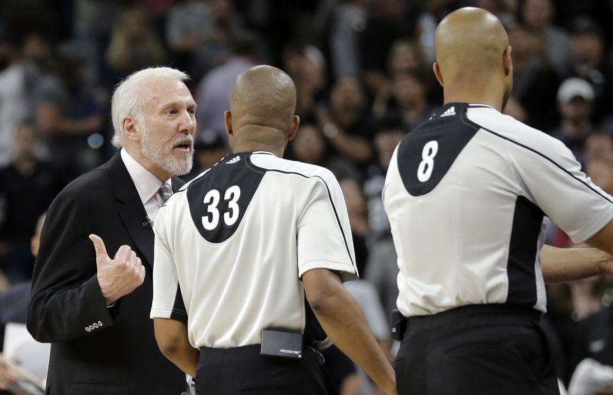 San Antonio Spurs head coach Gregg Popovich, left, argues with officials during the second half in Game 2 of a second-round NBA basketball playoff series, Monday, May 2, 2016, in San Antonio. Oklahoma City won 98-97. (AP Photo/Eric Gay)
