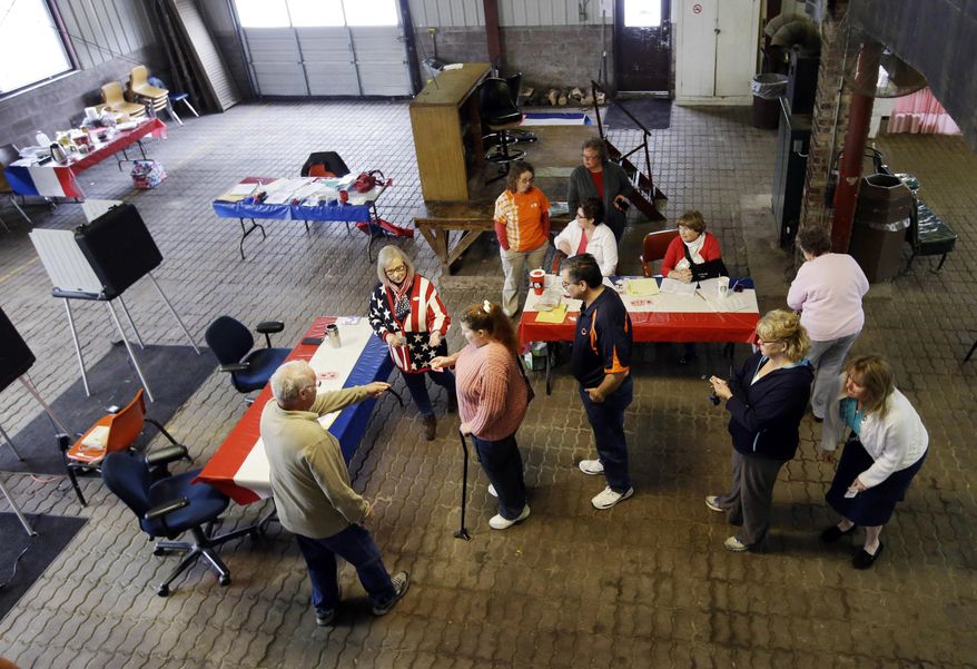 Voters wait to cast their ballot in the Indiana Primary at the Hamilton Co. Auto Auction, Tuesday, May 3, 2016, in Noblesville, Ind. (AP Photo/Darron Cummings)