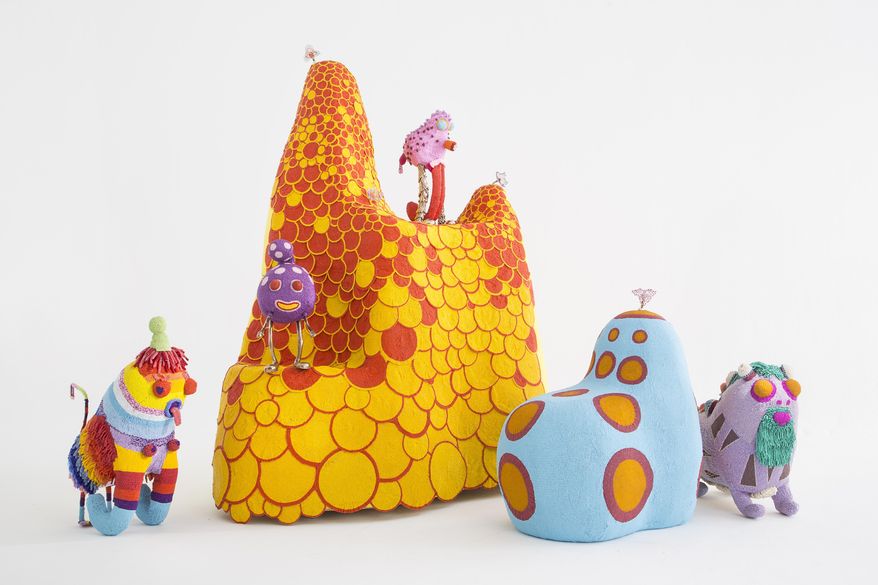 This undated photo provided by the Cooper Hewitt, Smithsonian Design Museum shows pieces of a collection of bold and blindingly bright beaded creatures dubbed "Afreaks." The pieces, in which feelings of joy and possibility seem almost palpable, are by the Los Angeles based Haas Brothers, in collaboration with the Haas Sisters, a group of artists from South Africa. The collection is part of the exhibit "Beauty - Cooper Hewitt Design Triennial," an exhibit at the Cooper Hewitt, Smithsonian Design Museum in New York and offers visitors the chance to take a good long look at the state of contemporary design, offering eye-popping works from around the globe and hinting at where things seem to be headed. The exhibit runs through Aug. 21. (Joe Kramm, R & Company/Cooper Hewitt, Smithsonian Design Museum via AP)