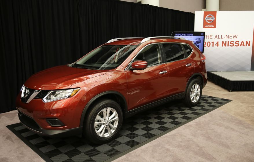 FILE - In this Tuesday, Sept. 10, 2013, file photo, the Nissan 2014 Rogue is unveiled in Farmington Hills, Mich. Nissan is recalling more than 108,000 Rogue small SUVs in the U.S. because the rear hatch door could fall on people without warning.The recall covers Rogues from the 2014 to 2016 model years. The company says in government documents that salt water can get into the rear lift gate supports and cause rust. The supports can lose gas pressure and break, increasing the risk of injury. (AP Photo/Carlos Osorio, File)