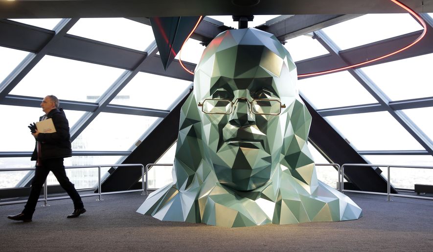 FILE - In this Nov. 24, 2015 file photo, a person walks past a sculpture of Benjamin Franklin at the One Liberty Observation Deck in Philadelphia. The City of Brotherly Love will get a lot of attention later this summer during the Democratic National Convention, with attractions ranging from American history classics to new parks and outdoor venues. (AP Photo/Matt Rourke, File)