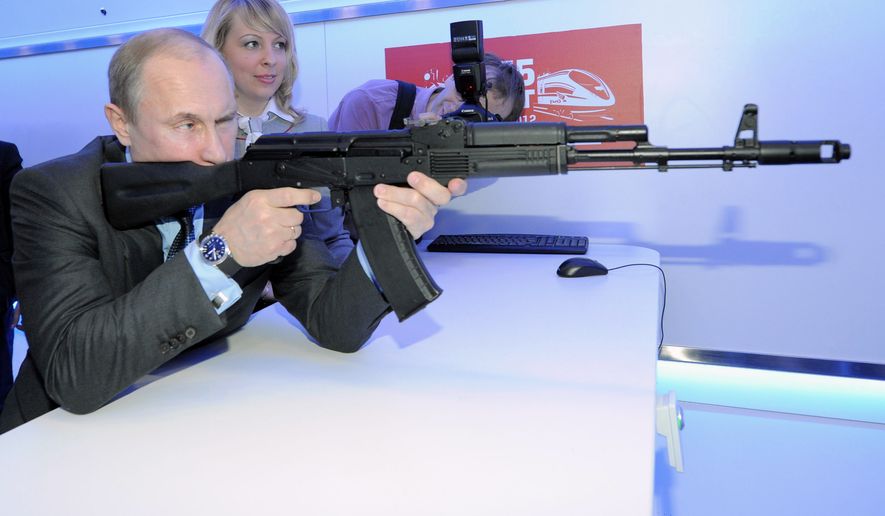 Russian Prime Minister Vladimir Putin Putin aims at a target with a replica of the AK-47 assault rifle in a shooting gallery while attending an exhibition of Russian Railways&#39; research center in Moscow, Thursday, April 26, 2012. (AP Photo/RIA-Novosti, Alexei Druzhinin, Government Press Service) ** FILE **