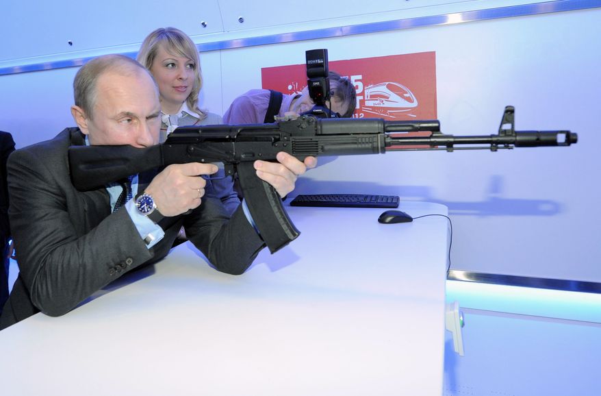 Russian Prime Minister Vladimir Putin Putin aims at a target with a replica of the AK-47 assault rifle in a shooting gallery while attending an exhibition of Russian Railways' research center in Moscow, Thursday, April 26, 2012. (AP Photo/RIA-Novosti, Alexei Druzhinin, Government Press Service) ** FILE **