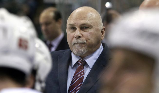 Washington Capitals head coach Barry Trotz watches play from the bench during the first period of an NHL hockey game against the Dallas Stars Saturday, Feb. 13, 2016, in Dallas. (AP Photo/LM Otero)