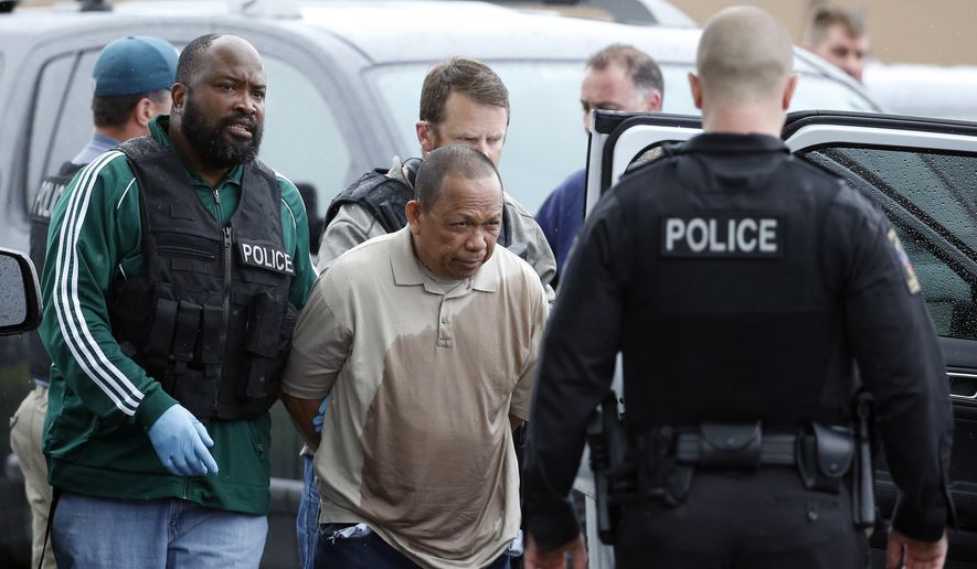 Police take Eulalio Tordil, 62, a suspect in three fatal shootings in the Washington, D.C., area into custody in Silver Spring, Md., Friday, May 6, 2016. Tordil is an employee of the Federal Protective Service, which provides security at federal properties. He was put on administrative duties in March after a protective order was issued against him. (AP Photo/Alex Brandon) ** FILE **