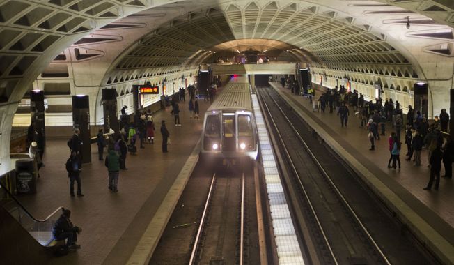 FILE - In this Jan. 13, 2015 file photo, a subway train arrives at the L&#x27;Enfant Metro Station in Washington. (AP Photo/Pablo Martinez Monsivais, File) **FILE**