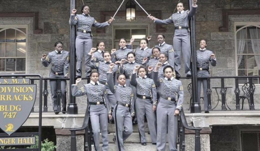 This undated image obtained from Twitter on Saturday, May 7, 2016 shows 16 black, female cadets in uniform with their fists raised while posing for a photograph at the United States Military Academy at West Point, N.Y. The U.S. Military Academy has launched an inquiry into the image that has spurred questions about whether the gesture violates military restrictions on political activity. (Obtained from Twitter via AP)