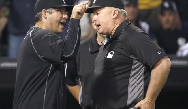 Chicago White Sox&#x27;s Robin Ventura, left, argues with umpire crew chief Bill Miller after Jose Abreu was hit by a pitch from Minnesota Twins relief pitcher Trevor May during the eighth inning of a baseball game Friday, May 6, 2016, in Chicago. Miller ejected Ventura and the White Sox went on to win 10-4. (AP Photo/Charles Rex Arbogast)