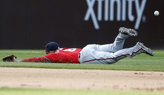 Washington Nationals shortstop Danny Espinosa cannot make the play on a single hit by Chicago Cubs&#39; Ryan Kalish during the sixth inning of a baseball game Saturday, May 7, 2016, in Chicago. (AP Photo/Nam Y. Huh)