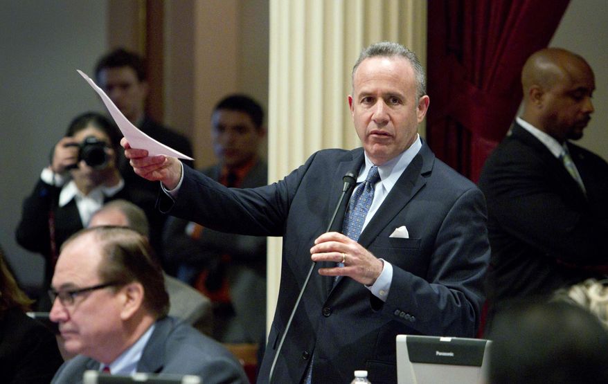 FILE - In this March 28, 2014 file photo, California Senate President Pro Tem Darrell Steinberg, D-Sacramento, introduces a resolution to suspend three Democrats facing charges in criminal cases, at the Capitol in Sacramento, Calif. Proposition 50 on the June primary ballot would amend the state constitution to allow legislators to suspend their peers without pay. All three lawmakers put on leave in 2014 continued to receive paychecks while suspended. (AP Photo/Steve Yeater, File)