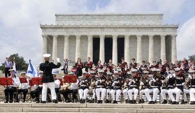 A joint Russian and American marine band performing at the Lincoln Memorial to celebrate the 65th anniversary of the &quot;Meeting at the Elbe River&quot; on April 25, 1945.