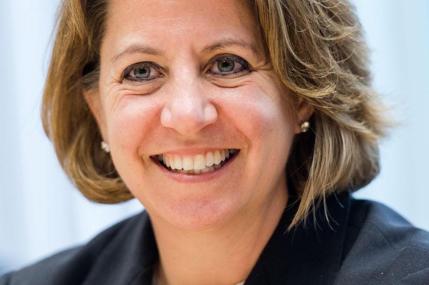 Lisa Monaco, assistant to the U.S. president for homeland security and counterterrorism smiles as she talks with journalists at the U.S. - European Media Hub in Brussels on Tuesday May 10, 2016. A U.S. government delegation is in Belgium to promote greater intelligence-sharing by Belgian and European authorities in the wake of the March bombings that killed 32 victims in Brussels. (AP Photo/Geert Vanden Wijngaert)