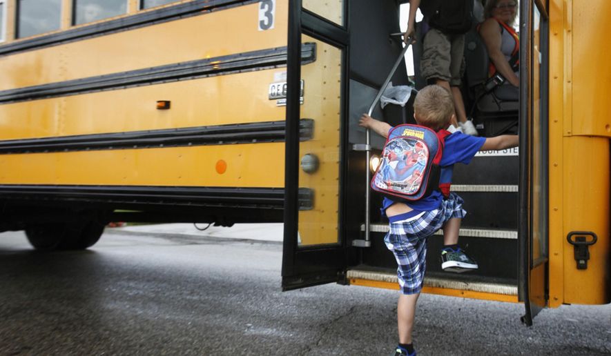 In this Sept. 4, 2012 photo, a student at Indian Lake Elementary in Kalamazoo, Mich., boards a bus on the first day of school. Bullying is a “serious public health problem,” and should no longer be dismissed as merely a matter of kids being kids, a leading panel of experts warned Tuesday, May 10, 2016. Bullying behavior is seen as early as preschool and peaks during the middle school years, the researchers said. And the problem has morphed from the traditional bully-in-the-schoolyard scenario to newer forms of electronic aggression, such as cyberbullying on social media sites. (AP Photo/The Kalamazoo Gazette, Mark Bugnaski, File)
