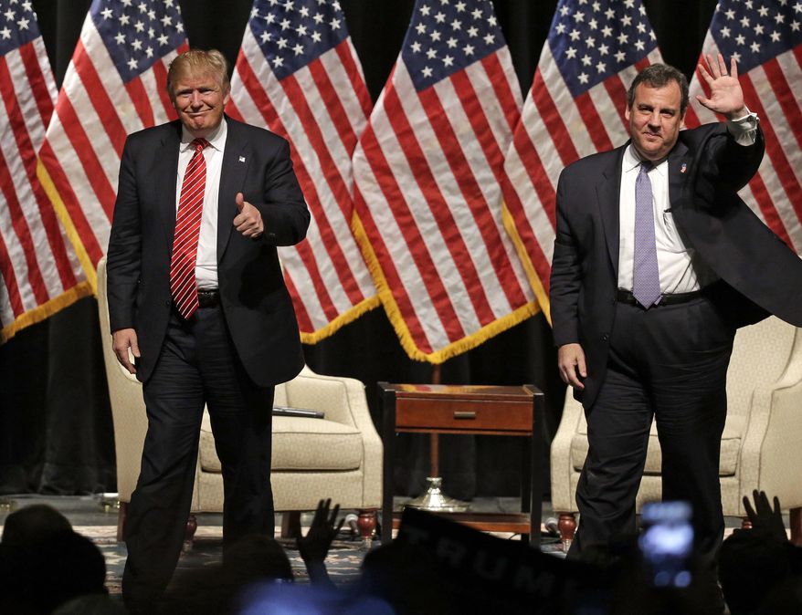 FILE - In this March 14, 2016 file photo, Republican presidential candidate Donald Trump gives a thumbs up as New Jersey Gov. Chris Christie waves to the crowd as they walk off the stage after a rally at Lenoir-Rhyne University in Hickory, N.C. Christie’s decision to endorse Donald Trump back in February brought him plenty of derision at the time. But it’s bringing rewards now that it’s clear he bet on the winner. (AP Photo/Chuck Burton, File)