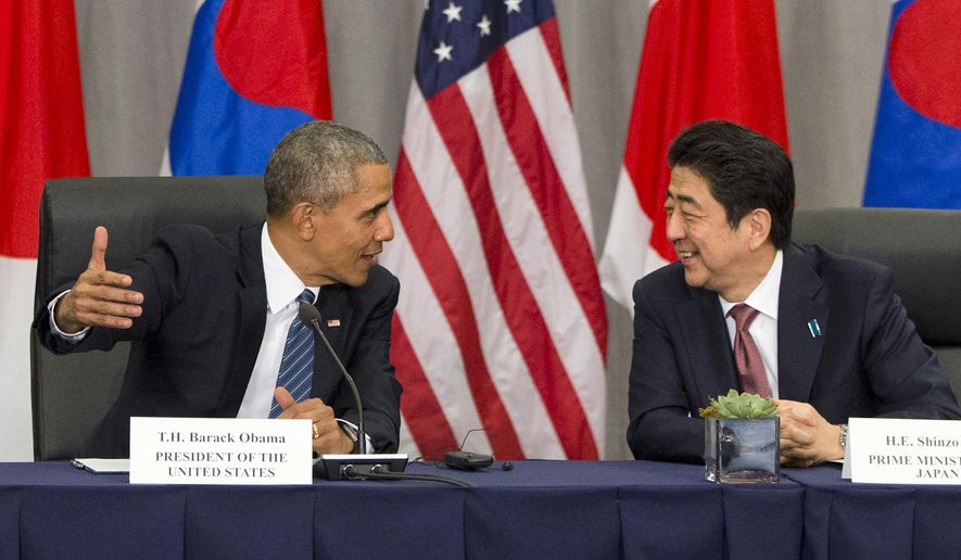 FILE - In this March 31, 2016, file photo, U.S. President Barack Obama speaks with Japanese Prime Minister Shinzo Abe during their meeting at the Nuclear Security Summit in Washington. Obama will travel to Hiroshima in May 2016 in the first visit by a sitting American president to the site where the U.S. dropped an atomic bomb. The White House says Obama will visit along with Abe during a previously scheduled visit to Japan. (AP Photo/Jacquelyn Martin, File)