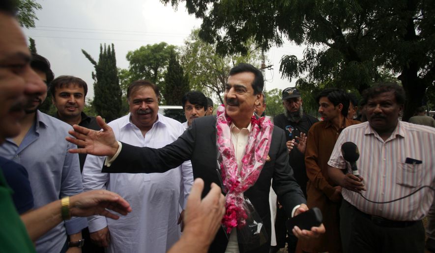 Pakistan&#39;s former Prime Minister Yusuf Raza Gilani, center, being greeted by supporters at outside his residence in Islamabad, Pakistan, Tuesday, May 10, 2016. A joint raid by U.S. and Afghan forces on Tuesday rescued his son who was held captive for three years by Islamic militants, officials said. Ali Haider Gilani was found during the raid near Afghanistan&#39;s eastern border with Pakistan, according to a spokesman for Afghan President Ashraf Ghani. (AP Photo/Anjum Naveed)