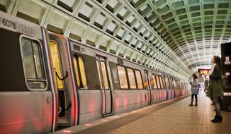 In this photo taken March 12, 2015, passengers wait on the platform before boarding a train at the U Street Metro Station in Washington. (AP Photo/Pablo Martinez Monsivais) ** FILE **