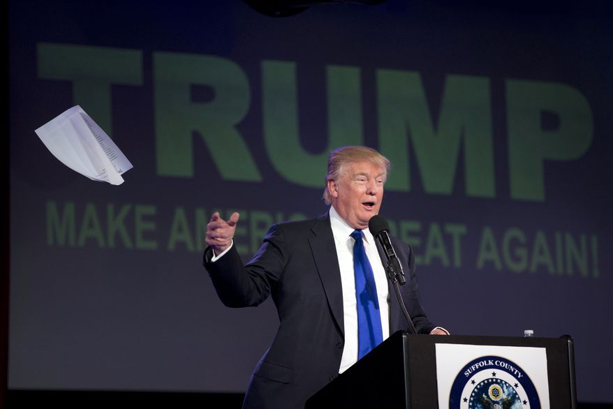 Republican presidential candidate Donald Trump tosses his notes as he speaks during a Suffolk County Republican Committee fundraising reception April 14 in Patchogue, N.Y. (Associated Press)