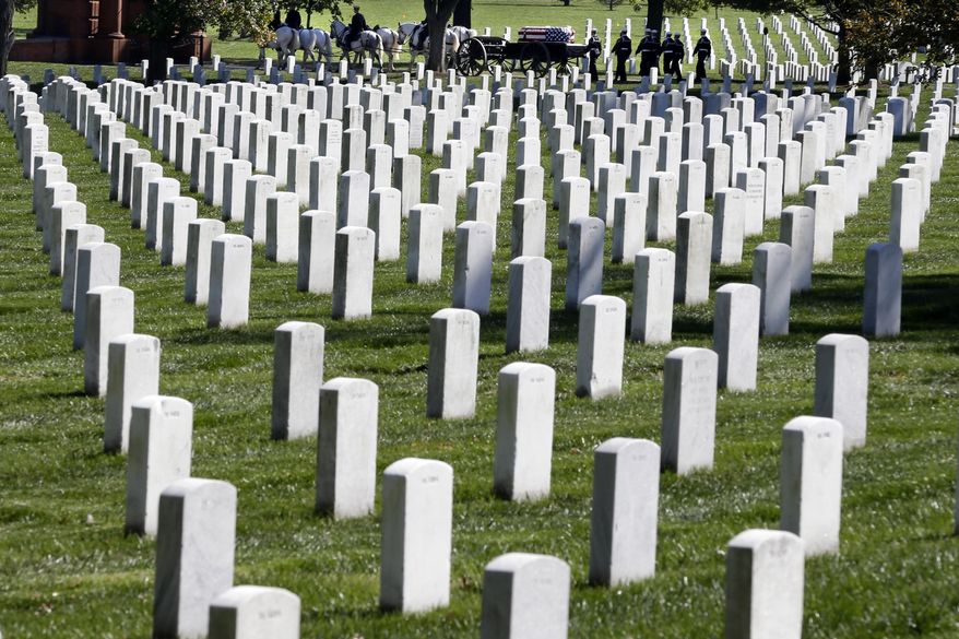 A funeral procession passes behind rows of graves at Arlington National Cemetery in Arlington, Va., Oct. 22, 2012. (AP Photo/Jacquelyn Martin, File) ** FILE **