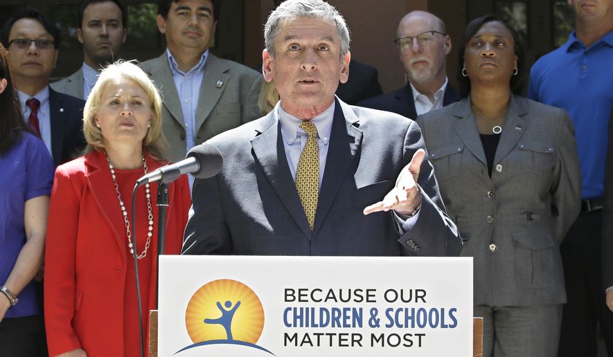 Eric Heins, president of the California Teachers Association, answers questions concerning a proposed ballot initiative asking voters to extend a temporary income tax increase on the wealthy, at a news conference, Wednesday, May 11, 2016, in Sacramento, Calif. Accompanied by representatives of other unions, hospitals and doctor's, Heins said they will turn in more then enough signatures to qualify the initiative for the November ballot. (AP Photo/Rich Pedroncelli)