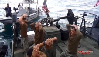 This frame grab from video taken on January 12, 2016, by the Iranian state-run IRIB News Agency shows the detention of U.S. Navy sailors by the Iranian Revolutionary Guards in the Persian Gulf. (IRIB News Agency via Associated Press) ** FILE **
