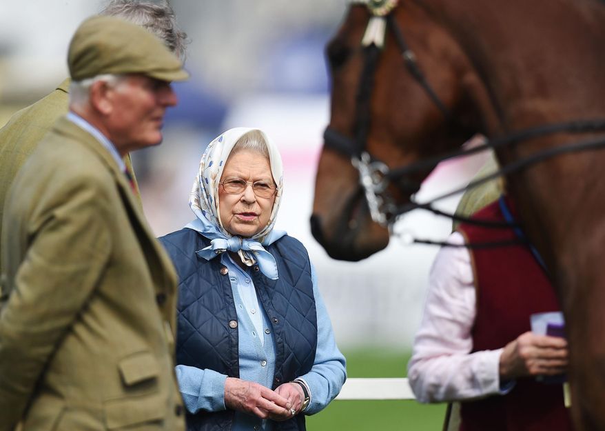 Britain's Queen Elizabeth II looks towards a horse during the Royal Windsor Horse Show, which is held in the grounds of Windsor Castle in Windsor England Thursday May 12, 2016. Queen Elizabeth II is set to celebrate 90th birthday again. A festival beginning Thursday involving 900 horses, 1,500 people marks Queen Elizabeth II’s 90th birthday. The event is at the halfway mark in a two-month celebration of the long-reigning monarch. (Andrew Matthews/PA via AP) UNITED KINGDOM OUT