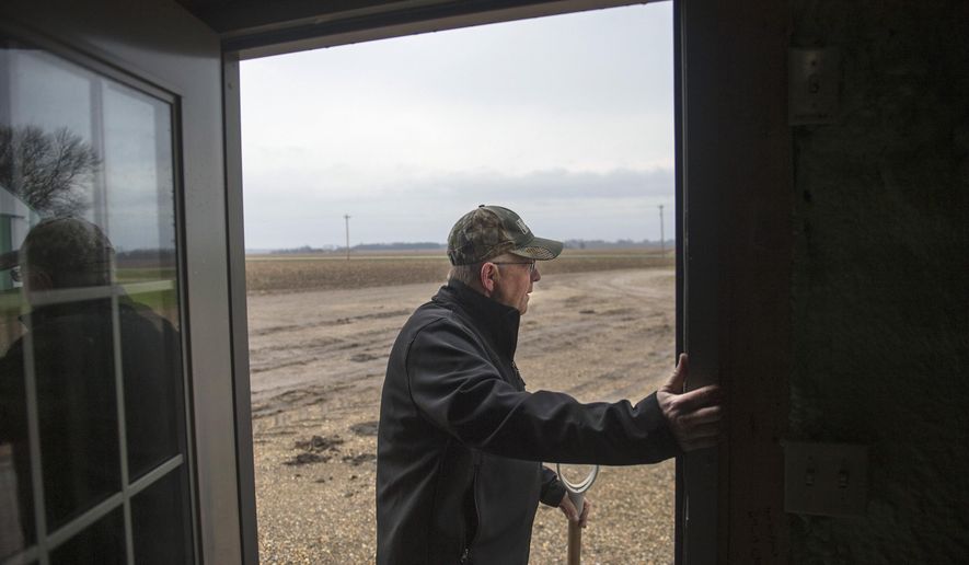 ADVANCE FOR USE SATURDAY, MAY 14 AND THEREAFTER - In this April 6, 2016, photo, farmer Russell Jackson checks the skies to determine the day's activities on his Stark County farm near Wyoming, Ill. Jackson has known nothing but farming for 40 years of his 59-year-old life. The farmland, which is nearing 120 years old, stretches across 2,750 acres over Marshall and Stark counties. (David Zalaznik/Journal Star via AP) MANDATORY CREDIT