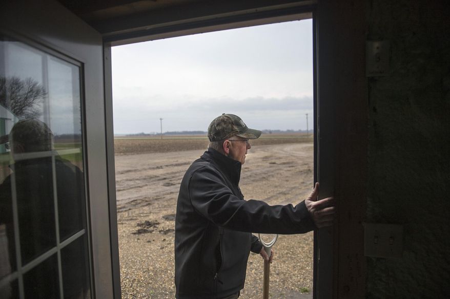 ADVANCE FOR USE SATURDAY, MAY 14 AND THEREAFTER - In this April 6, 2016, photo, farmer Russell Jackson checks the skies to determine the day's activities on his Stark County farm near Wyoming, Ill. Jackson has known nothing but farming for 40 years of his 59-year-old life. The farmland, which is nearing 120 years old, stretches across 2,750 acres over Marshall and Stark counties. (David Zalaznik/Journal Star via AP) MANDATORY CREDIT