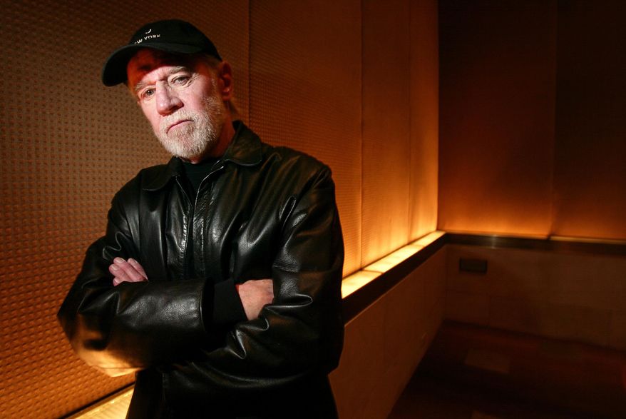 FILE - This March 19, 2004 file photo shows actor and comedian George Carlin posing for a photo in a New York hotel. The National Comedy Center currently being built in Jamestown has acquired Carlin’s archives. This is the first major donation to the center, which is scheduled to open in 2017. (AP Photo/Gregory Bull, File)