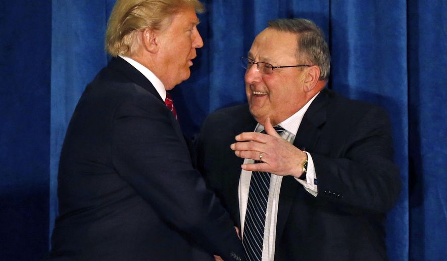 FILE - In this March 3, 2016, file photo, Republican presidential candidate Donald Trump is welcomed to the stage by Maine Gov. Paul LePage, in Portland, Maine. LePage has floated the idea he could play a role in a Trump presidency, a move that might benefit the state's Senate president, a fellow Republican with whom he has had a tepid relationship .(AP Photo/Robert F. Bukaty, File)