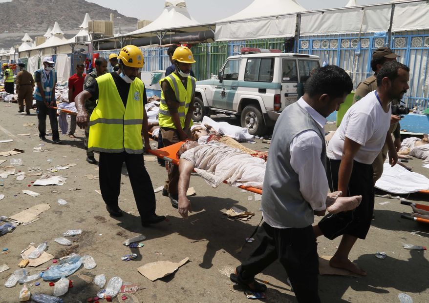 FILE - In this Thursday, Sept. 24, 2015 file photo, emergency services personnel attend to victims of a stampede in Mina, Saudi Arabia during the annual hajj pilgrimage. Iran will not send pilgrims to Saudi Arabia this year for the annual hajj pilgrimage, an Iranian official announced Thursday, May 12, 2016 the latest sign of tensions between the two Mideast powers after a disaster during the event last year killed at least 2,426 people. (AP Photo, File)