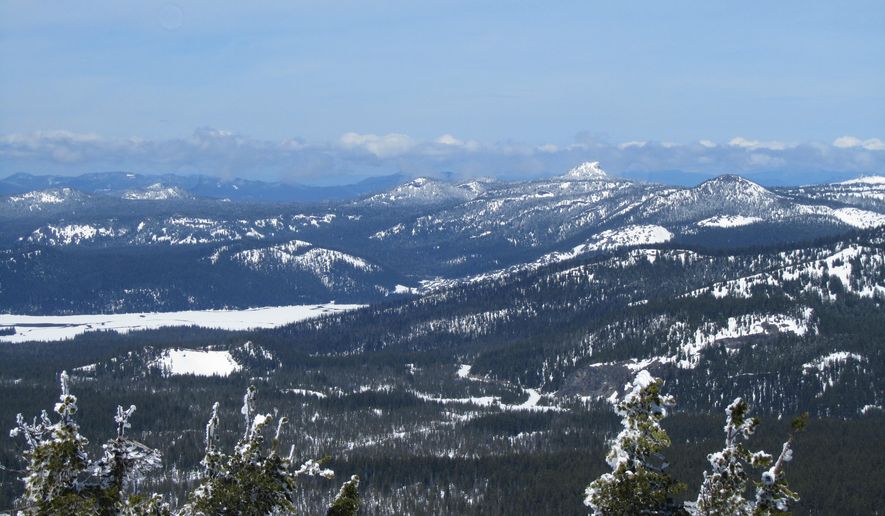 In this April 26, 2016, photo the Sparks Lake and surrounding hills are pictured from the top of Tumalo Mountain, west of Bend, Ore. (Mark Morical/The Bulletin via AP) MANDATORY CREDIT