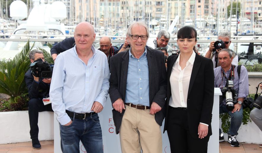 Actor Dave Johns, director Ken Loach and actress Hayley Squires, from left, pose for photographers, during a photo call for the film I, Daniel Blake at the 69th international film festival, Cannes, southern France, Friday, May 13, 2016. (AP Photo/Joel Ryan)
