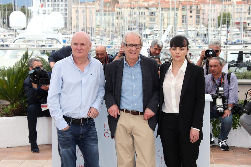Actor Dave Johns, director Ken Loach and actress Hayley Squires, from left, pose for photographers, during a photo call for the film I, Daniel Blake at the 69th international film festival, Cannes, southern France, Friday, May 13, 2016. (AP Photo/Joel Ryan)