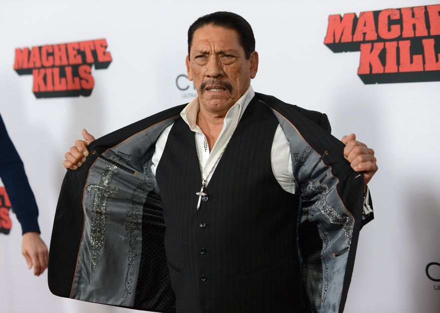 FILE - In this Oct. 2, 2013, file photo, actor Danny Trejo arrives at the premiere of "Machete Kills" at Regal Cinemas L.A. Live in Los Angeles. The Los Angeles Times reports Trejo took the floor at a community meeting at Sylmar High School in Los Angeles on May 11, 2016, following a brawl at the school. (Photo by Jordan Strauss/Invision/AP, File)