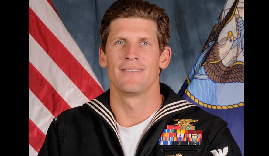 FILE - This undated U.S. Navy file photo shows Special Warfare Operator 1st Class Charles Keating IV, 31, of San Diego. The Navy SEALs are inviting people to line the streets in the military town of Coronado, to honor fallen SEAL Keating, as his remains are transported across the Coronado Bridge to San Diego to be buried at Fort Rosecrans National Cemetery, in Calif. The special warfare operator was killed May 3, 2016, in a gunbattle with Islamic State fighters in Iraq and is the third service member to die in the country since U.S. forces returned there in 2014. (U.S. Navy Photo via AP, File)